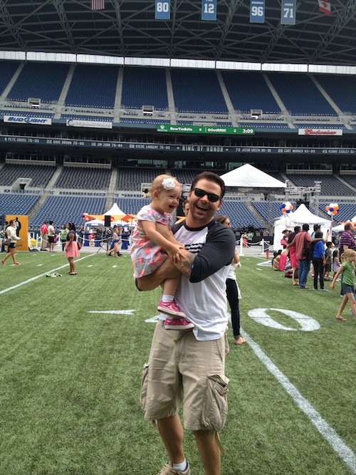 Ava and I playing on the Seahawks field