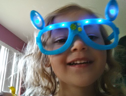 Ava taking a selfie with her new glasses on