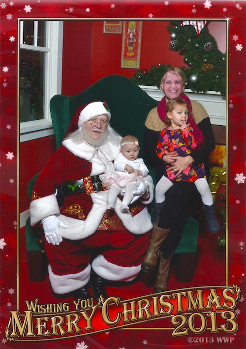 Visiting with Santa. Jessica's eyes were closed so we Photoshopped her face in from another photo. Not sure what's funnier, that or Ava's expression.