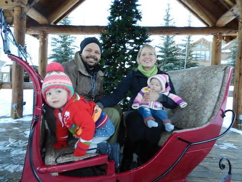 Family Photo on the sleigh - Dad just finished snowboarding