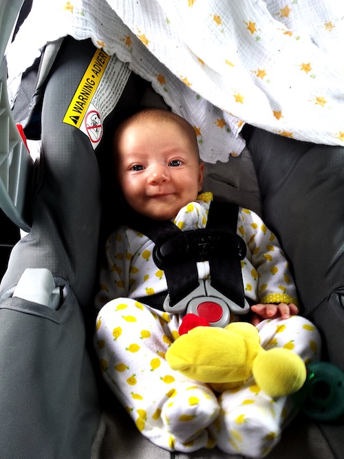 Happy in her car seat