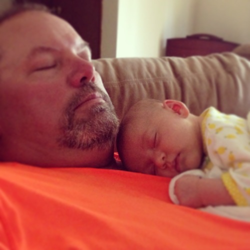 Elise napping with Grandpa