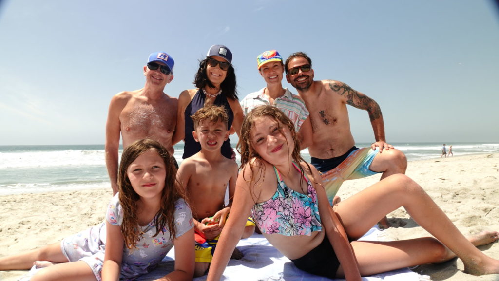 The Pellegrini family having a beach day in Carlsbad, CA
