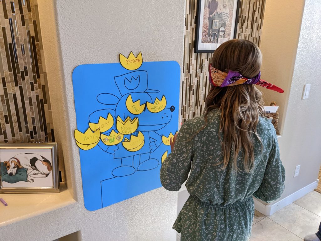 Ava playing Pin the badge on Dog Man