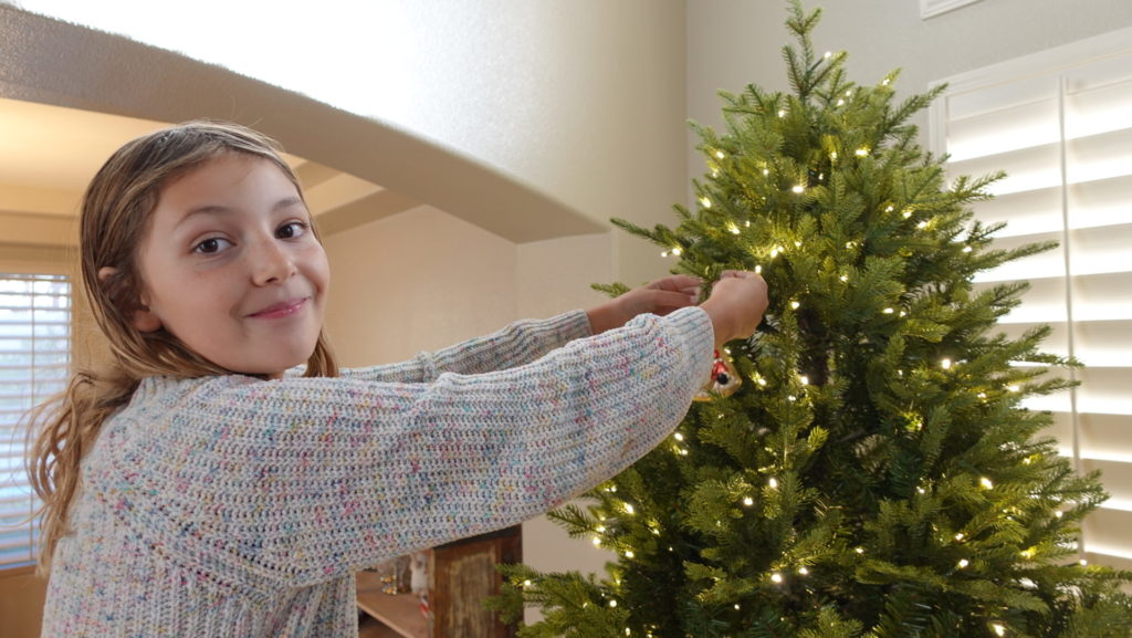 Ava Pellegrini decorating our Christmas tree