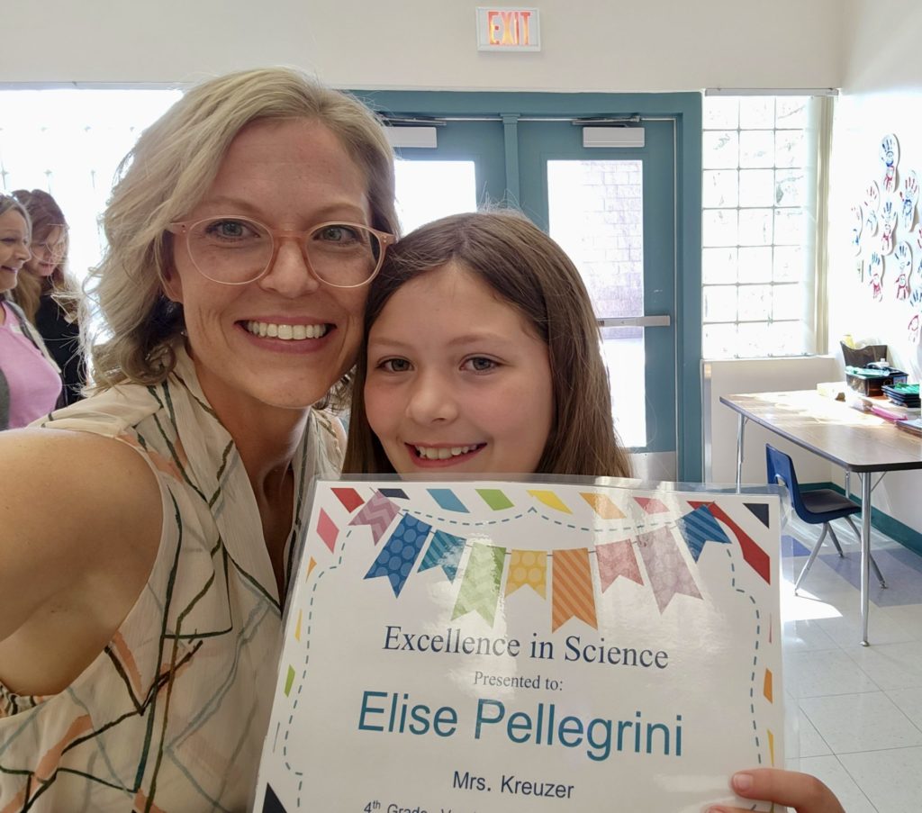 Jessica and Elise Pellegrini holding Elise's Excellence in Science award