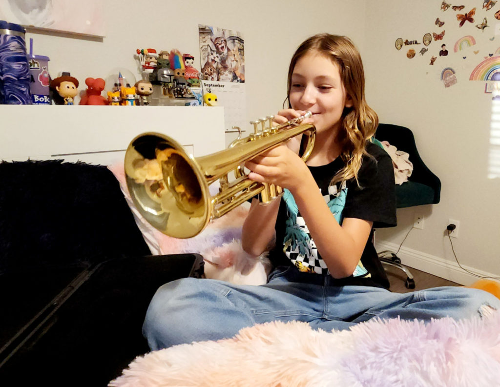 Ava practicing trumpet