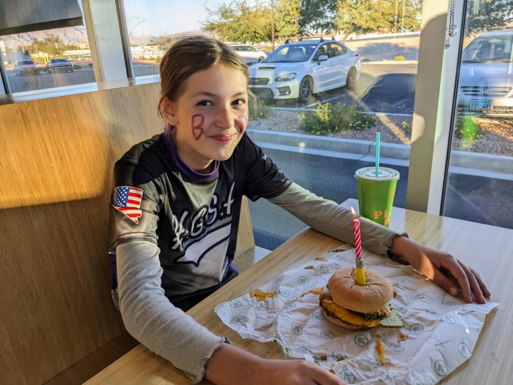 Ava ready to enjoy a burger from Plant Powered on her birthday