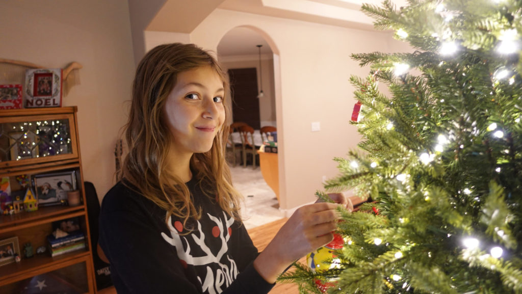 Ava decorating our Christmas tree