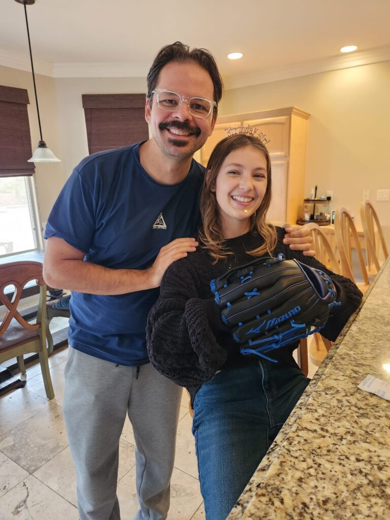 Ava and Dad with her new softball glove on her 13th birthday