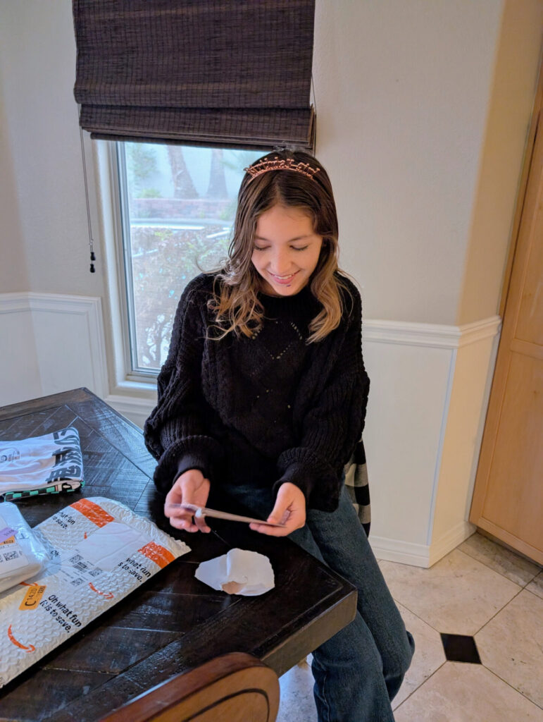 Opening presents on her birthday morning