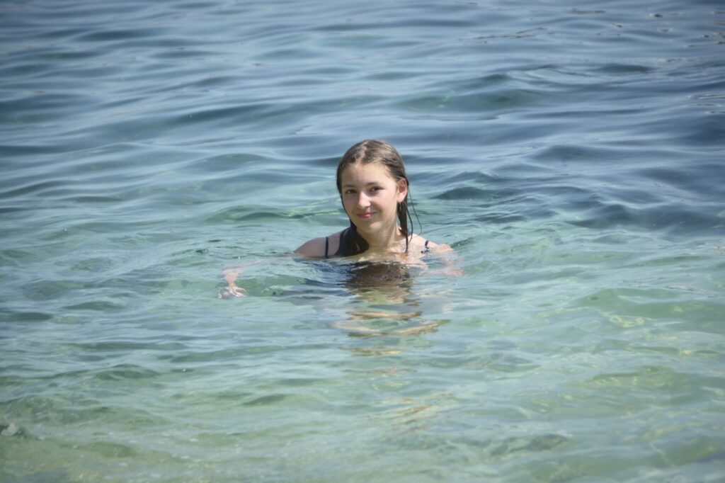 Ava Pellegrini in the water at Las Castelas beach