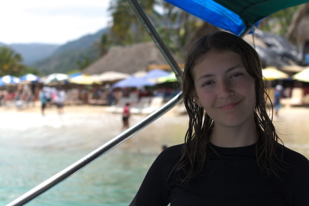 Ava Pellegrini on a boat at Mismaloya beach