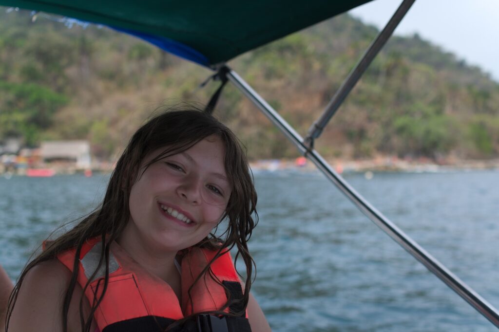 Elise Pellegrini on a boat at Mismaloya beach
