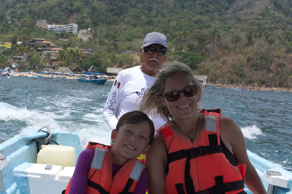 Jessica & Enzo Pellegrini on a boat at Mismaloya beach