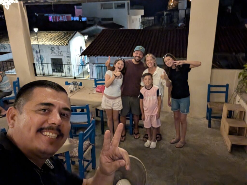 Pellegrini family with Christian, our server, at Mellisa's in Puerto Vallarta, Mexico