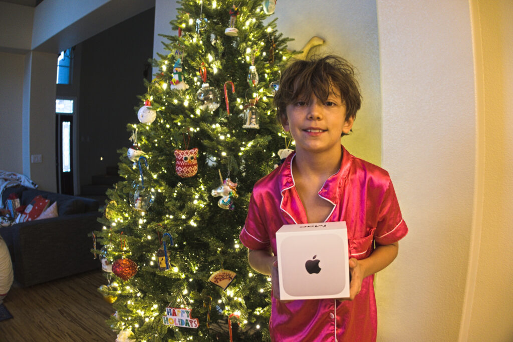 Enzo Pellegrini with his Mac Mini computer on Christmas morning, 2025