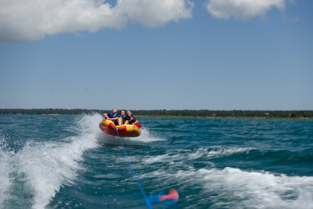 The Pellegrini kids tubing behind a speed boat on Lake Huron