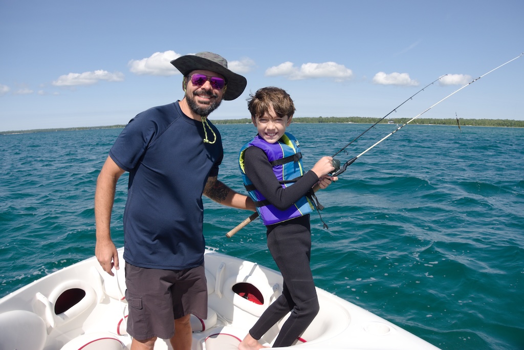 Michael and Enzo Pellegrini fishing on Lake Huron